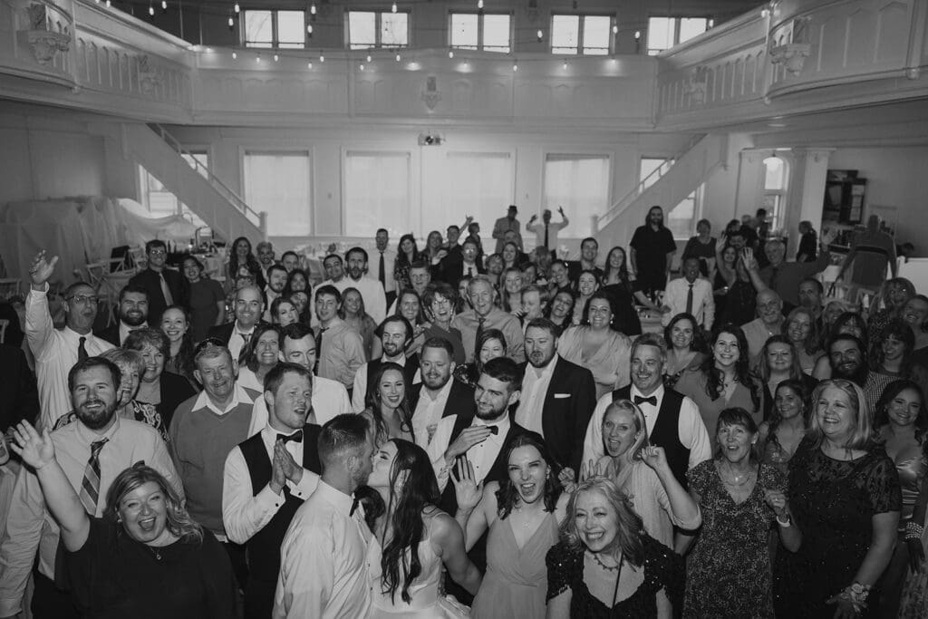 group photo to open the dance floor at this spring wedding in Kansas City