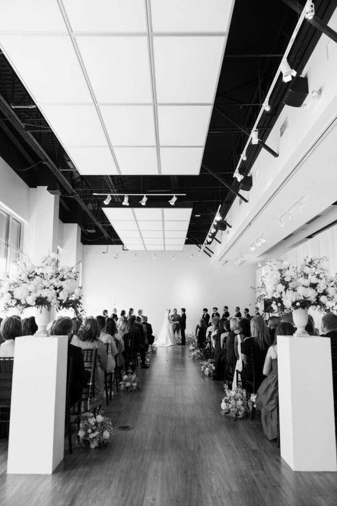Bride and groom saying vows during ceremony at The Gallery in Kansas City.