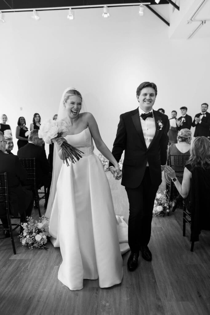 Bride and groom saying vows during ceremony at The Gallery in Kansas City.