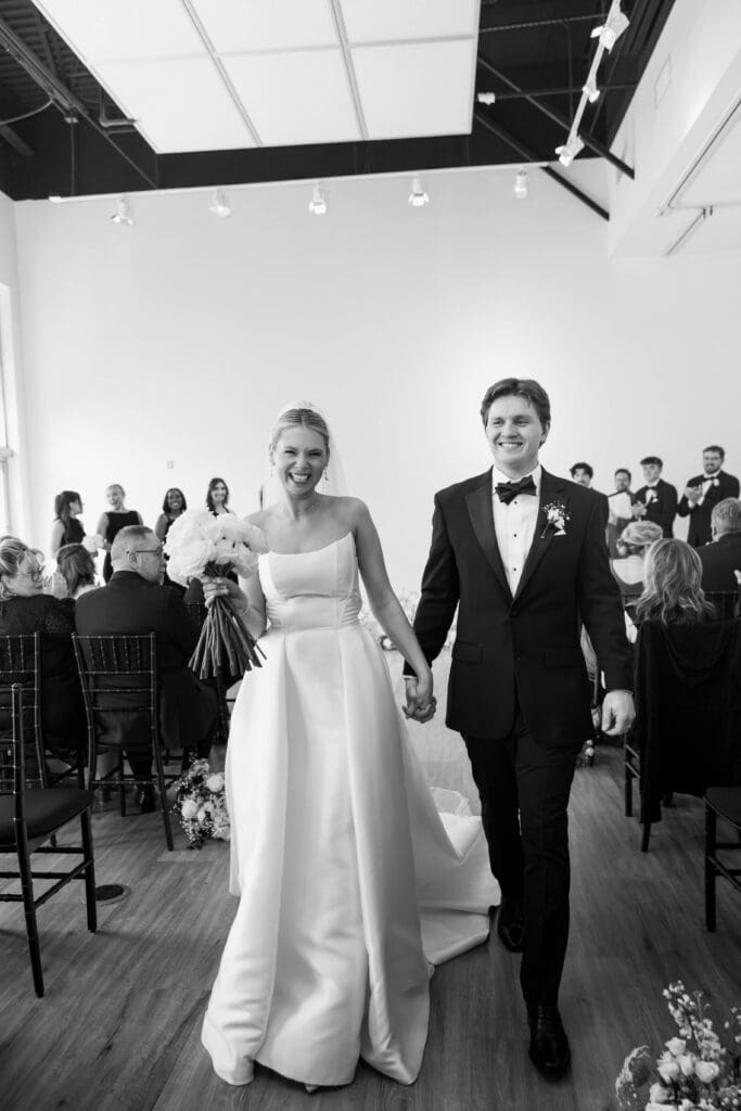 Bride and groom saying vows during ceremony at The Gallery in Kansas City.